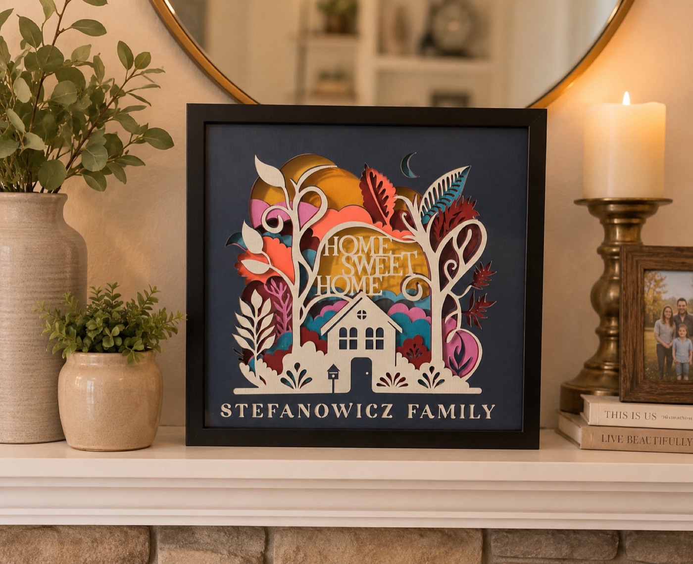 A layered paper-cut shadow box reading Home Sweet Home, personalised with a family name