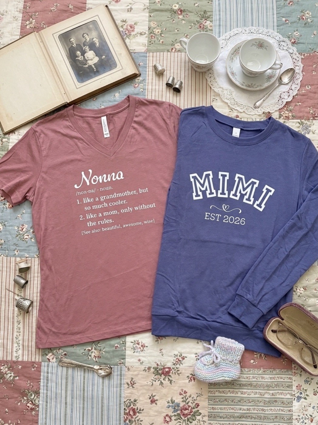 Two printed shirts for grandmothers, laid on a patchwork quilt beside an old photograph album